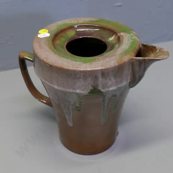 Temuka pottery - green and brown trickle glaze jug, Maori inscription on base & model #CP5 H190 W240