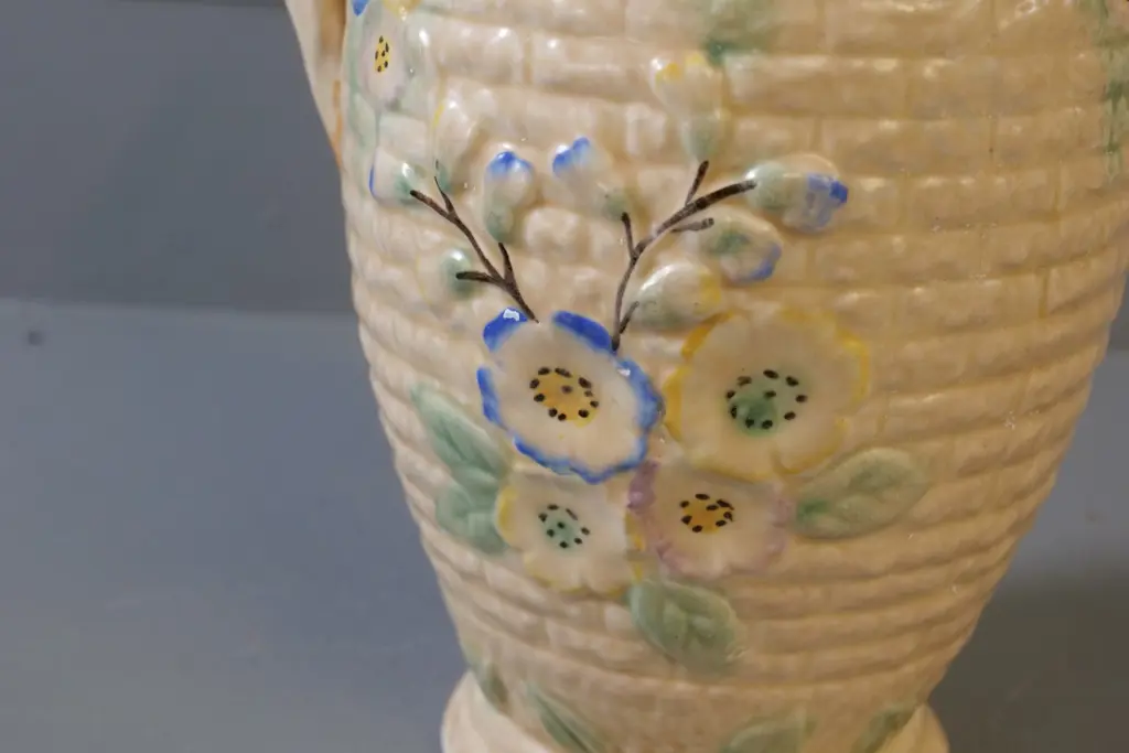 raised pattern handled vase (Arthur Wood?) - small chips to blue flower on one side. H-260 Image 1++