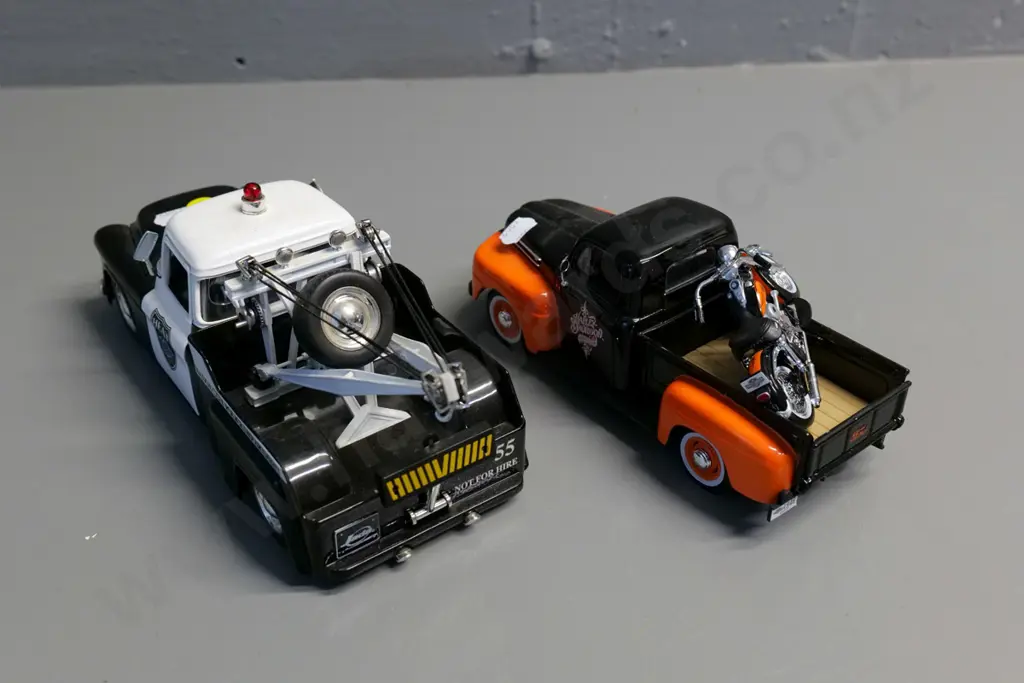 2 die-cast model trucks - 1:24 Jada Chevy step-side police tow truck & 1:25 Maisto Ford pickup with motorbike Image 1++