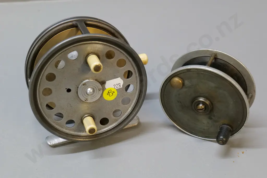 2 metal fishing reels, one with bone handles, larger is Hardy's The Silex No. 2, D-120 Image 1++