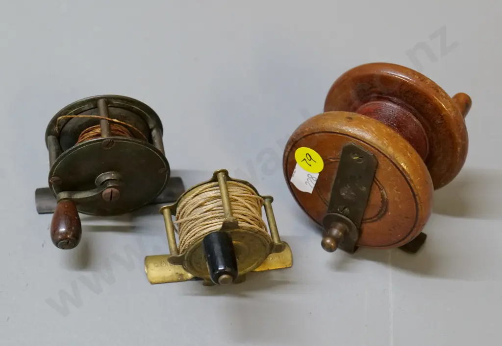 3 small vintage fishing reels - 2 brass & one wood diameter 70 - none have maker's mark Image 1++
