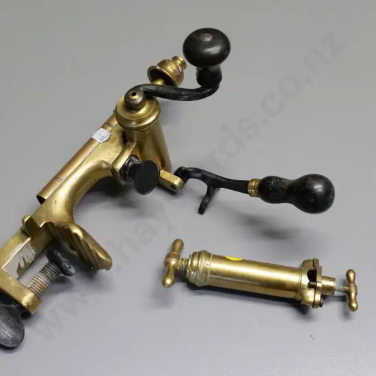 2 vintage heavy brass shotgun cartridge making items, larger one is bench mount L-270