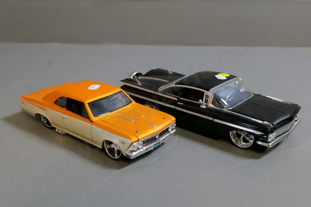 2 die-cast model cars - 1:24 Jada black Chevy Impala and 1:24 Maisto orange Chevy Chevelle Image 1++