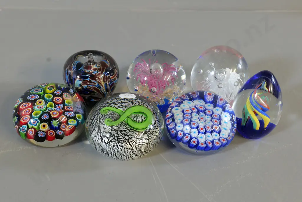 7 glass paperweights, 2 are millefiore style, one marked NZ Image 1++