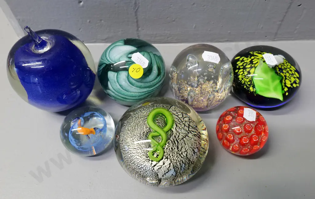 7 glass paperweights, one marked Vitrix '81, one marked NZ. Tallest is blue apple H-100 Image 1++