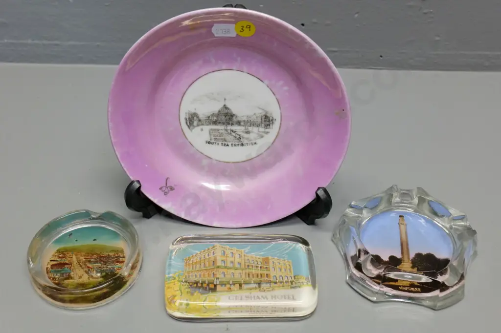 4 pieces souvenir ware - Dunedin Exhibition plate (worn) two Dunedin ashtrays, Brisbane paperweight D-170 Image 1++