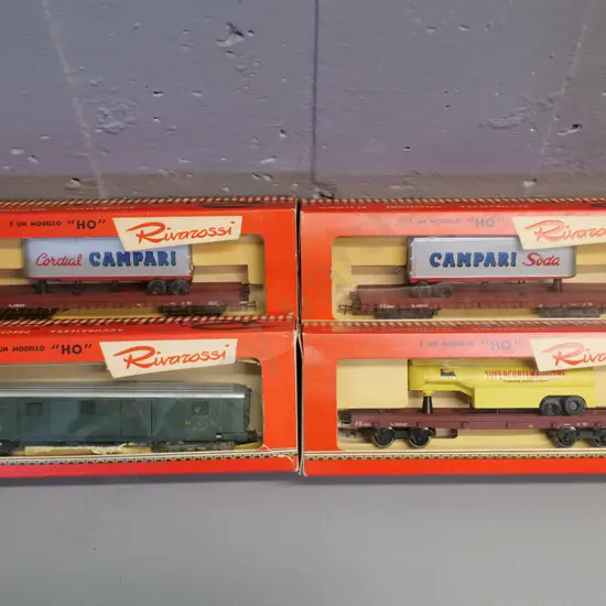 HO gauge model railway items - 4 boxed Rivarossi Italy - truck trailer carriers, cement etc.
