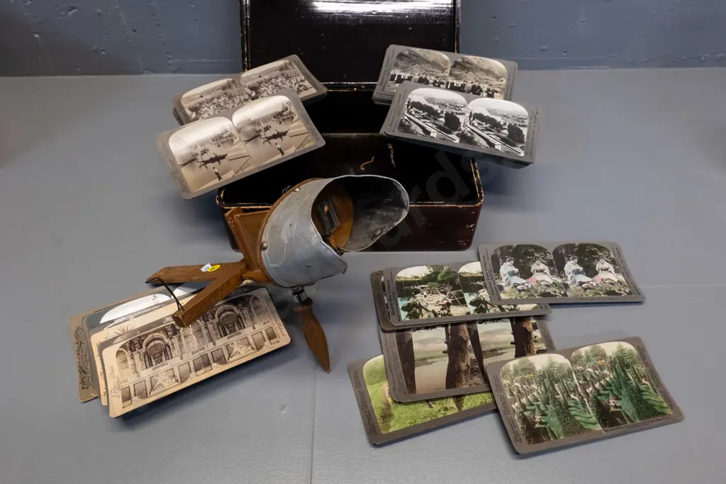 vintage stereoscope with stereo view cards - 8 hand-coloured and 48 black & white, all overseas, in worn laquered box Image 1++