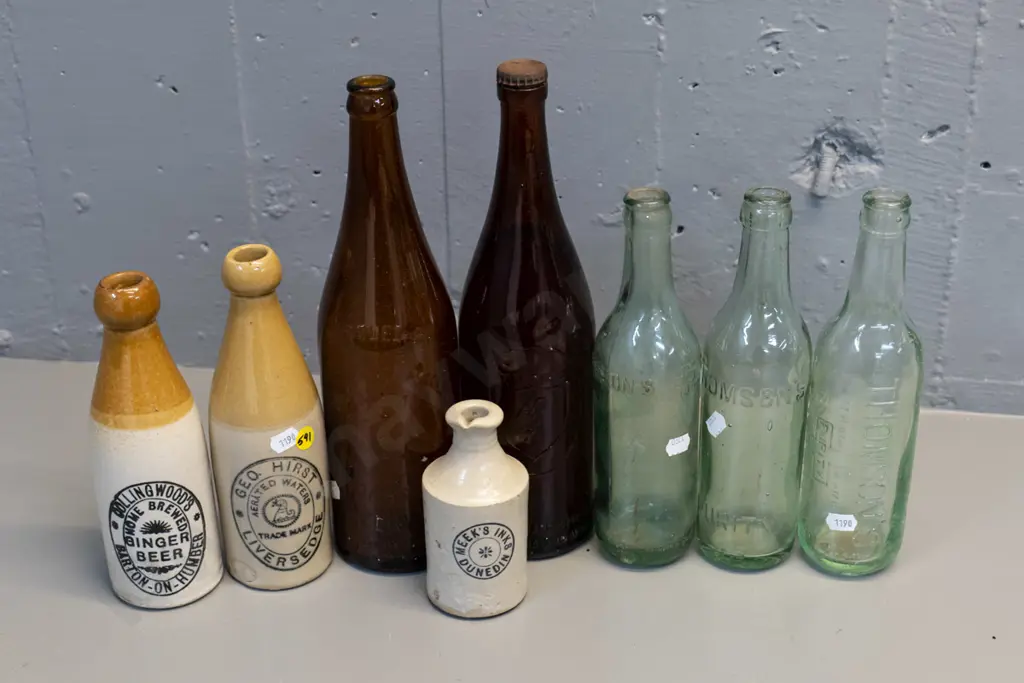 8 vintage bottles - one Meek's Dunedin stoneware ink bottle, 2 others, 2 English ginger beer, NZB, Powley, Lane-Thompson Image 1++