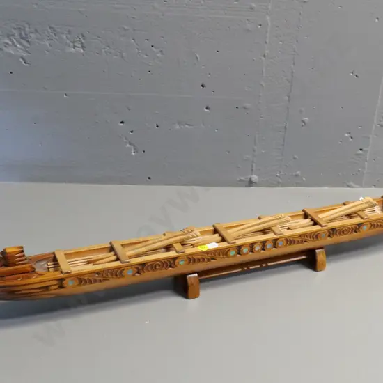 hand carved wooden waka model on wooden stand, with paddles, paua insets - has 'Te Aroha' sticker H280 L840