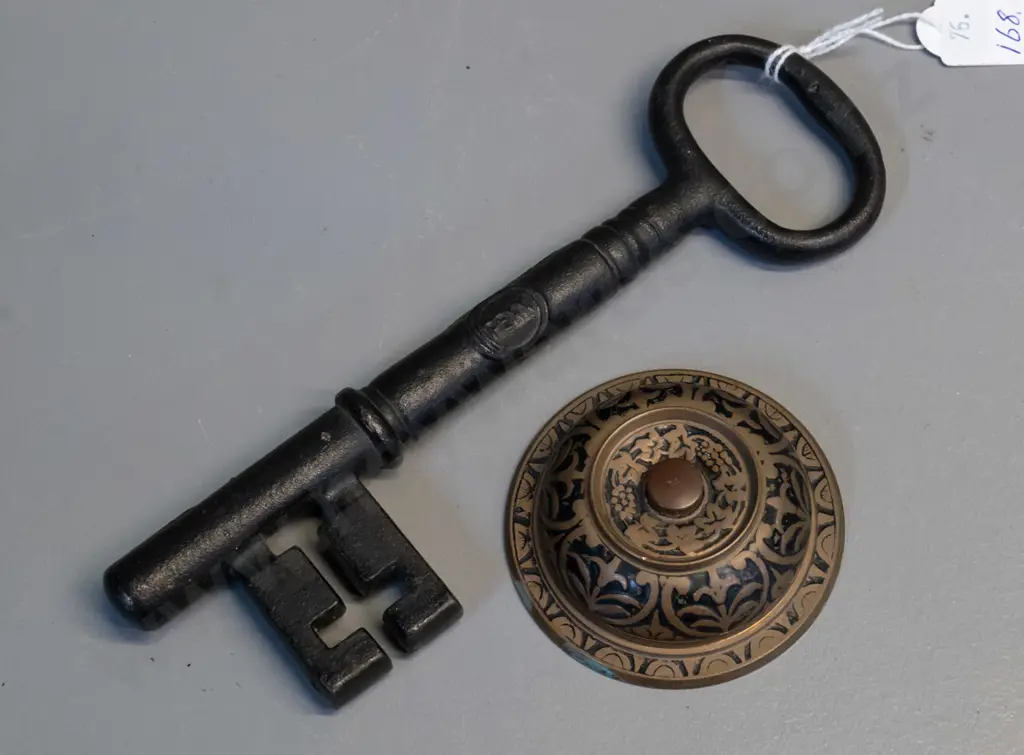 cast iron Penn Locks promotional key L-195 and a brass and enamel doorbell or buzzer button Image 1++