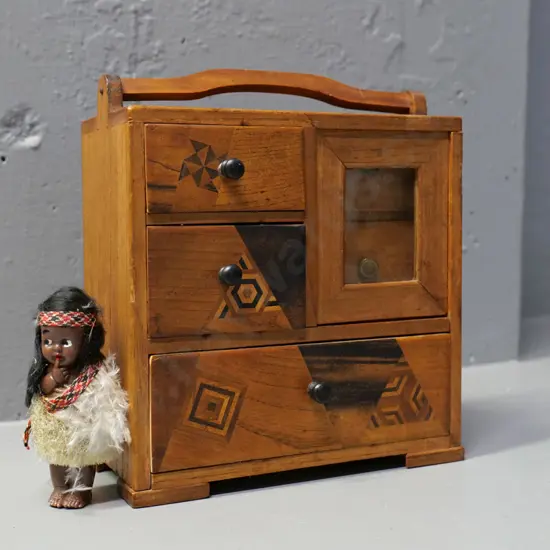 Japanese miniature chest with sliding window, inlaid designs H-170 W-170 D-90 and a small souvenir Maori doll
