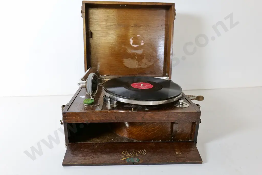 vintage Dulcetto portable wind-up gramophone and 2 albums of 78s plus needles - going condition, case needs attention Image 1++
