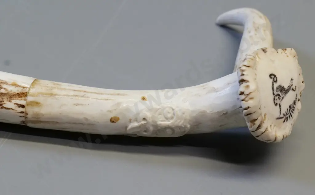 walking stick made from segments of horn with relief tiki motif, koru & fern motifs on handle L-880 Image 1++
