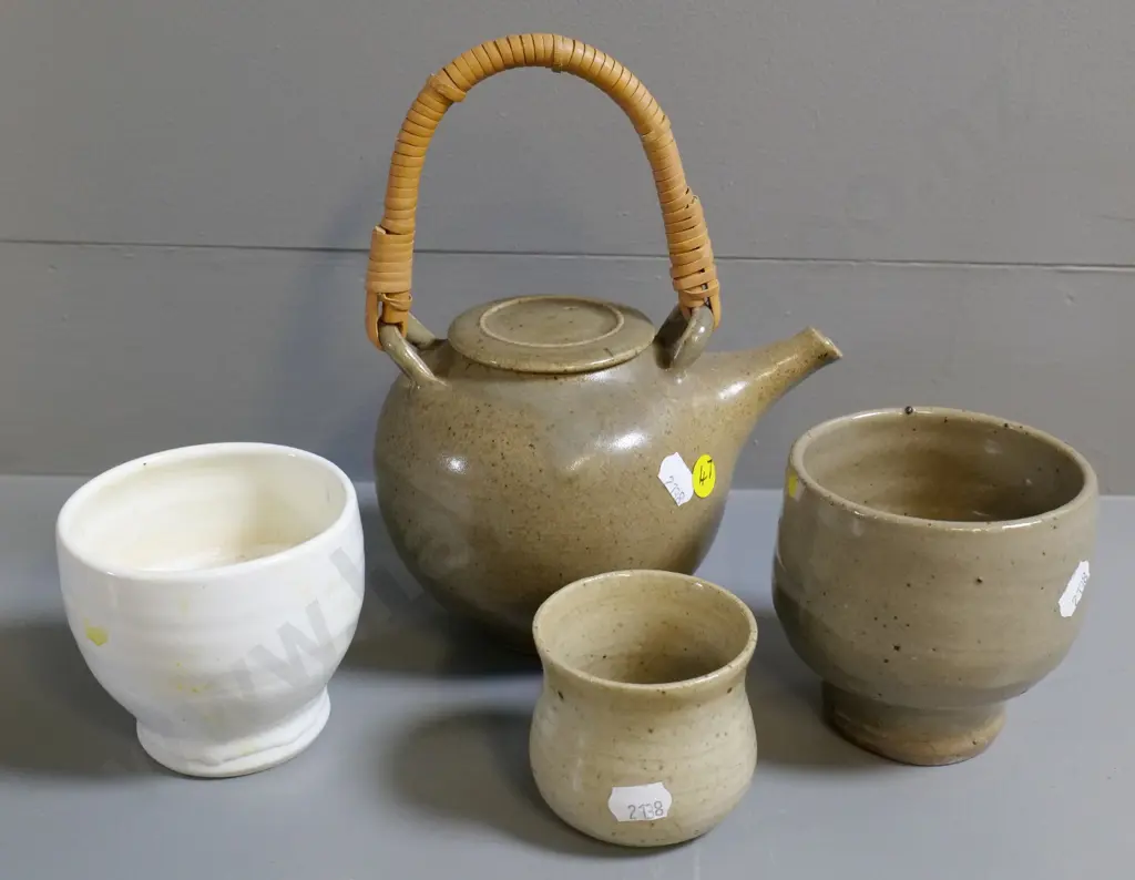hand-potted teapot with cane handle and 3 small beakers, smallest has unknown maker's mark. Teapot H-230 Image 1++