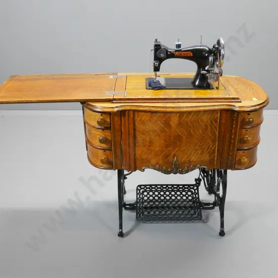 deco oak-cased Vickers treadle sewing machine with 6 drawers, flip-top leaf, knee lever H-780 W-870 D-470