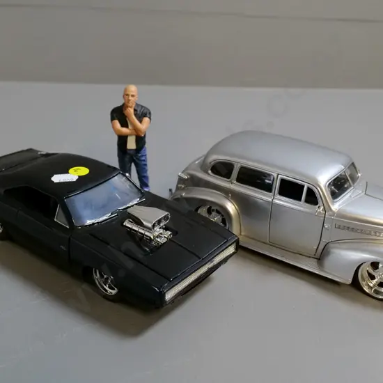 2 Jada die-cast model cars - 1:24  black Dodge Charger, 1:24 Chevrolet Master Deluxe and a figure