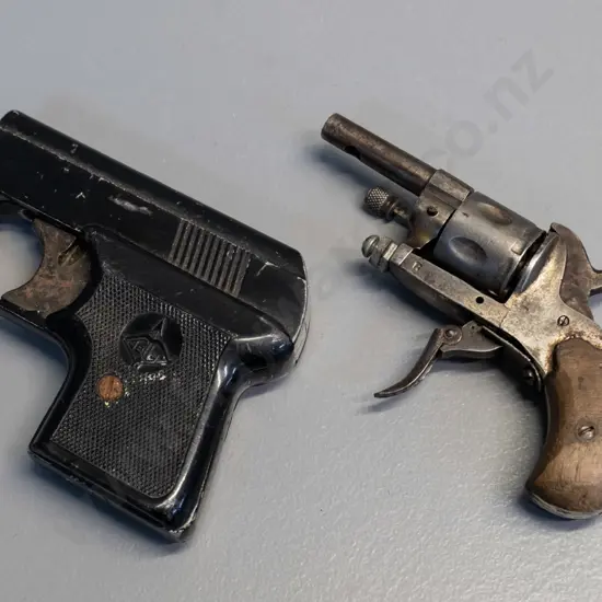 "Jelly" starter's pistol (corrosion, working condition unknown) and a miniature revolver (non working, barrel plugged)
