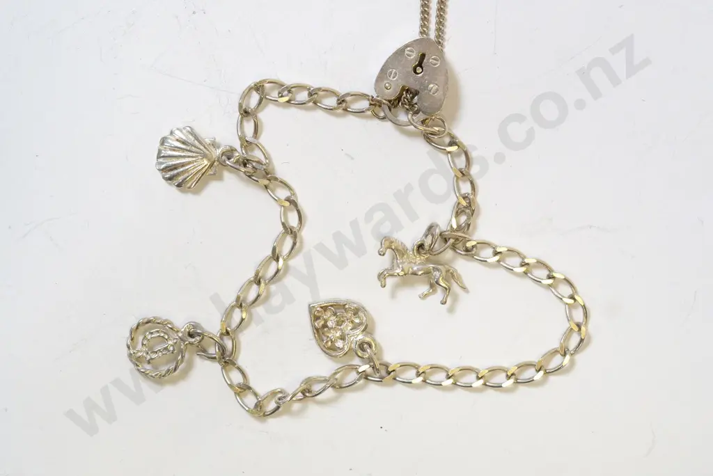 silver charm bracelet with horse, heart, the letter D & shell charms - clasp stamped 925 Image 1++