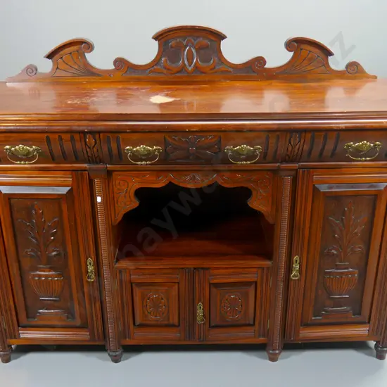 vintage kauri sideboard w/carved panel doors and upstand, 3 drawers & 4 doors - damage to polish on top H1160 W1510 D570