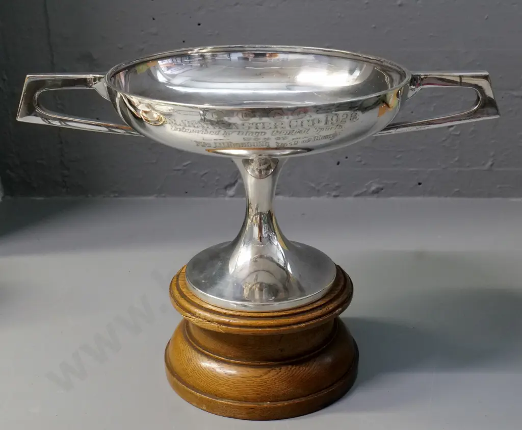 deco style plated trophy cup on oak base - inscribed 'Omakau Easter Cup 1928' w/names - small chip to oak H230 W330 Image 1++
