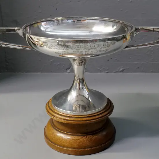 deco style plated trophy cup on oak base - inscribed 'Omakau Easter Cup 1928' w/names - small chip to oak H230 W330