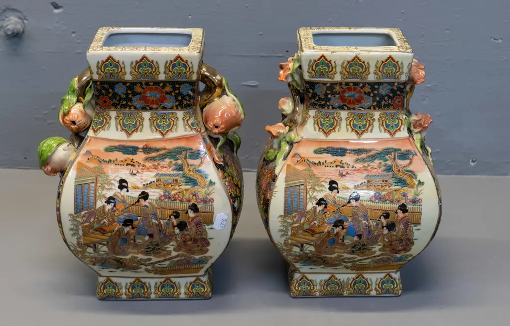 pair of Chinese hand painted ornately decorated vases - one has pomegranate handles, one flowers, has maker's mark H-270 Image 1++