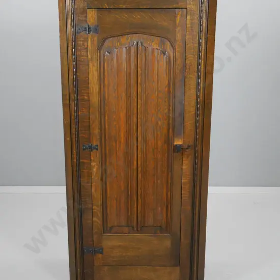 oak Tudor style corner cabinet with linen fold carved door, wooden door catch H-1350 W-620 D-360