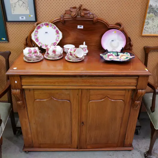 Victorian walnut chiffonier with carved back stand, key escutcheons & keys, casters. Some marks & split H1300 W1050 D460