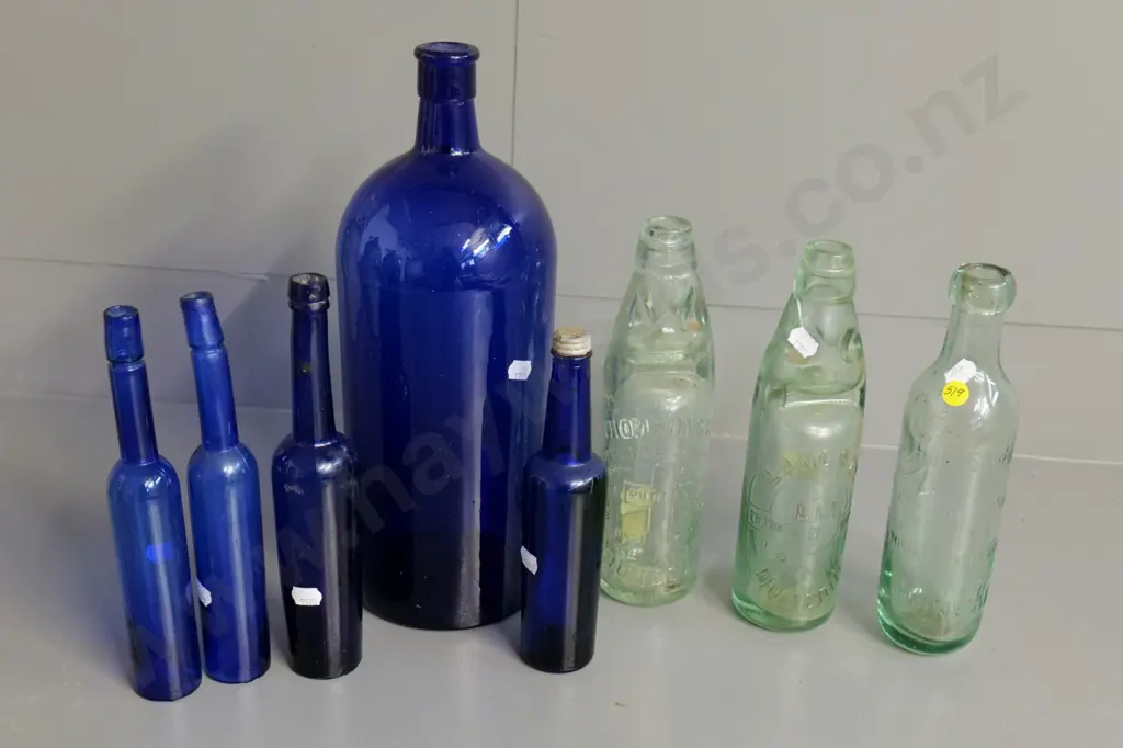 Bottles - Lanes marble with crack, Thomsons marble, Lane's Crystal Spring Mineral Water and 5 blue glass bottles Image 1++