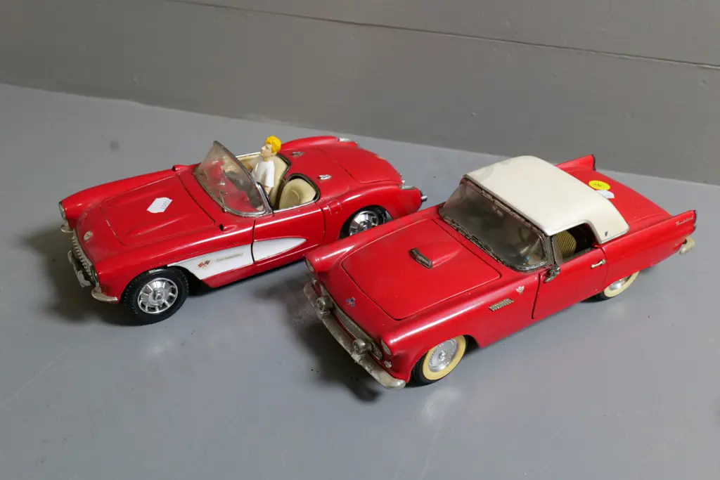 2 die-cast model cars - 1:18 Road Tough Ford Thunderbird and 1:18 Road Tough Chevy Corvette, plus figurine Image 1++