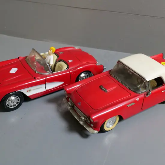 2 die-cast model cars - 1:18 Road Tough Ford Thunderbird and 1:18 Road Tough Chevy Corvette, plus figurine