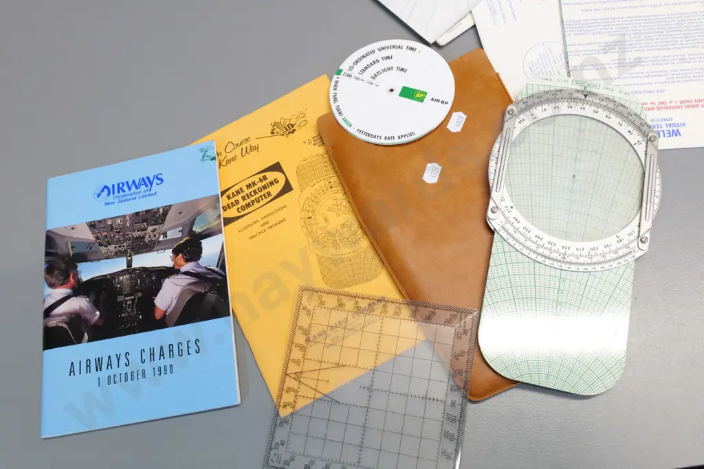 assorted pilot's aviation documents and navigation maps, calculators etc in battered small bullock hide Image 1++