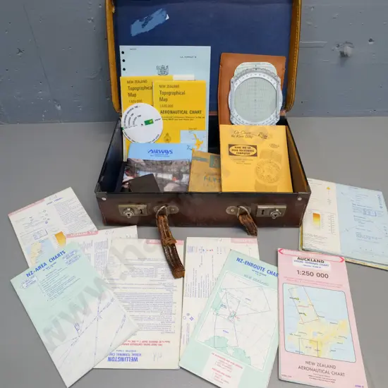 assorted pilot's aviation documents and navigation maps, calculators etc in battered small bullock hide
