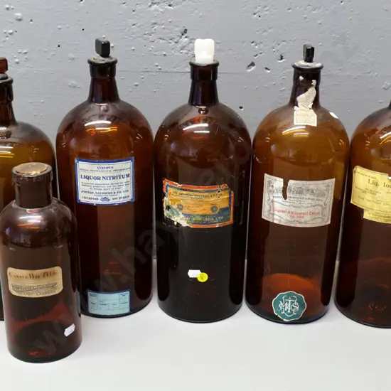 5 brown glass apothecary bottles, one with non-matching stopper, taller H370, smaller one with Lawrence NZ label