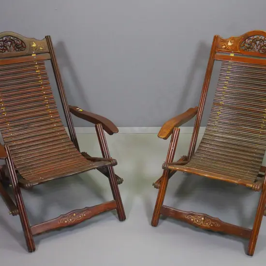 pair of Indian carved rosewood with brass inlay adjustable back slat-seat lounge/steamer chairs H800 W640 D1000
