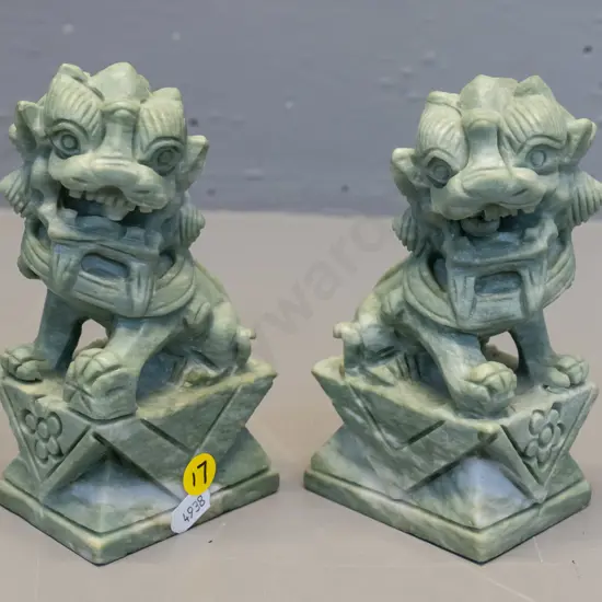 pair of carved mottled light green & white stone food dogs H-150