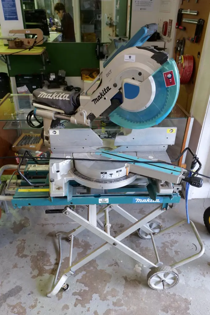 Makita DXT drop saw on stand with rollers Image 1++