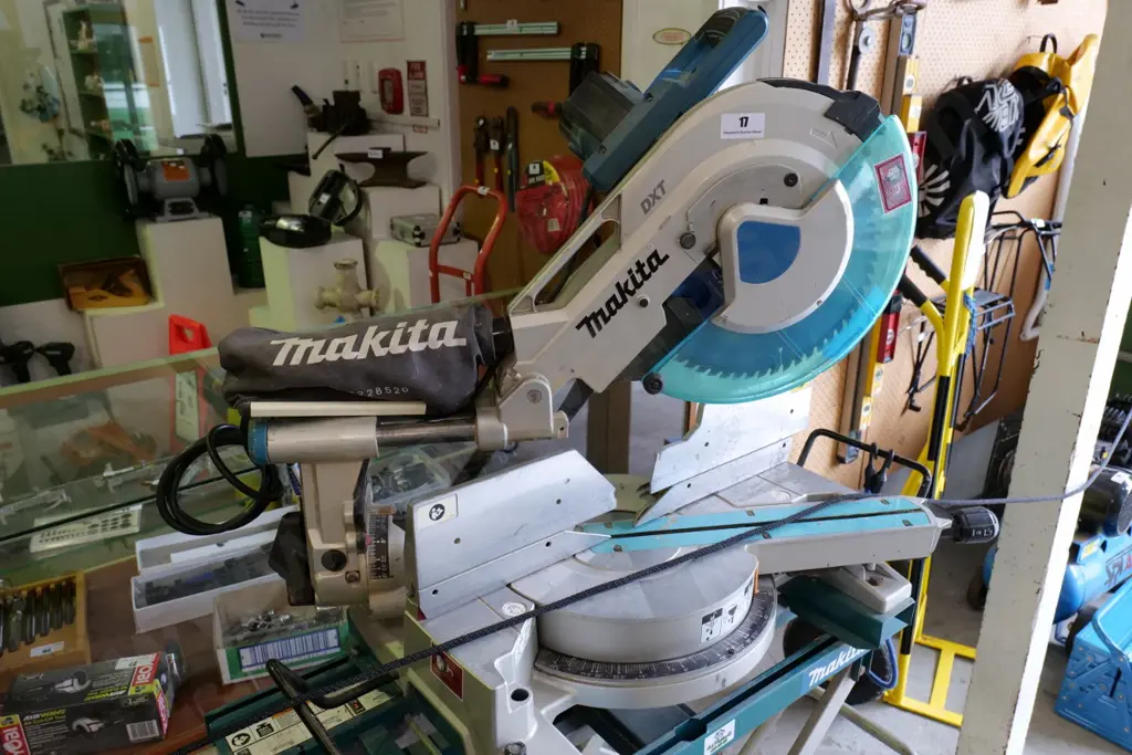 Makita DXT drop saw on stand with rollers Image 1++