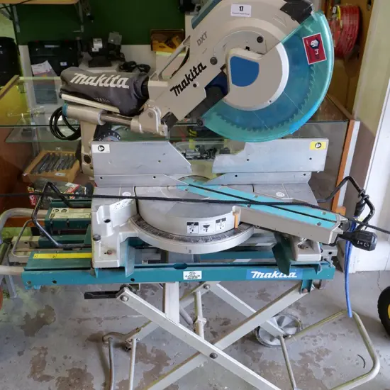 Makita DXT drop saw on stand with rollers