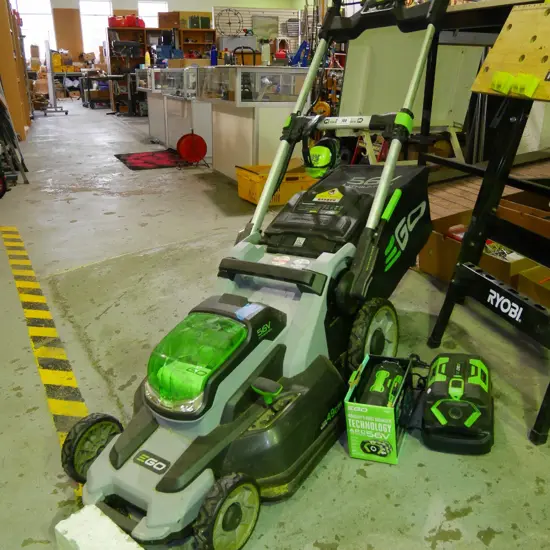 Ego 56V lithium-ion lawn mower with ear muffs, charger, 2 batteries