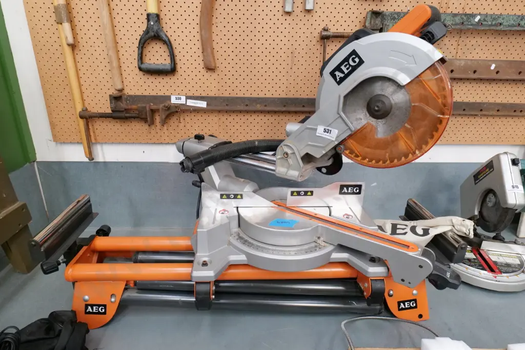 AEG compound sliding mitre saw with stand Image 1++