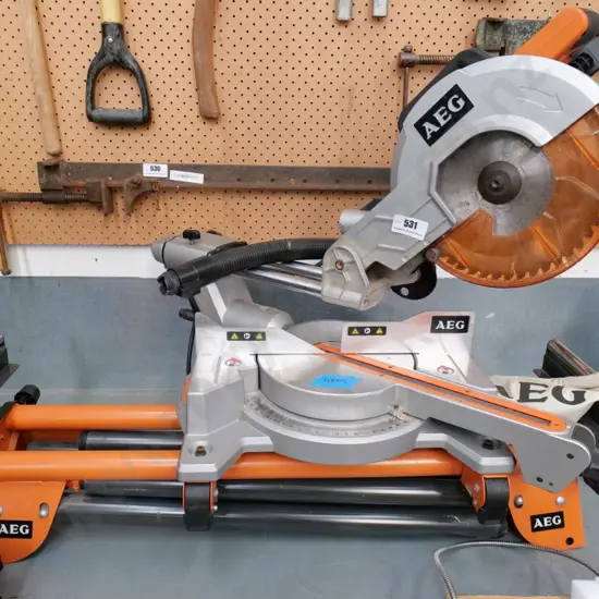 AEG compound sliding mitre saw with stand