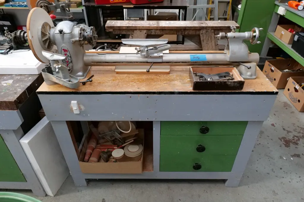 Myford woodworker's lathe on homemade cabinet with 1 box of various chucks and drill bits, box of sanding accessories Image 1++
