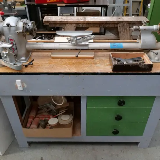 Myford woodworker's lathe on homemade cabinet with 1 box of various chucks and drill bits, box of sanding accessories