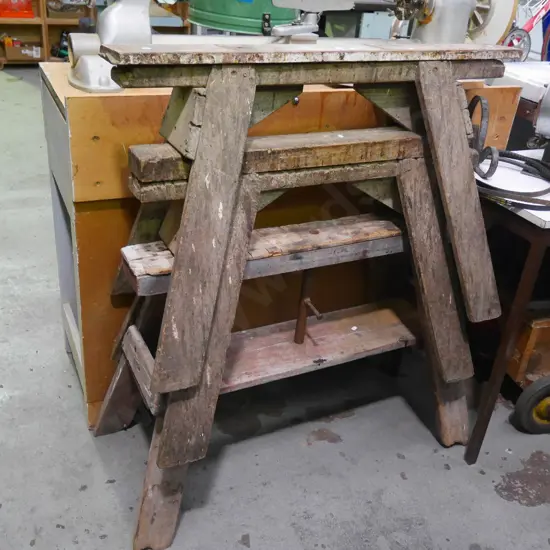 3 wooden saw horses