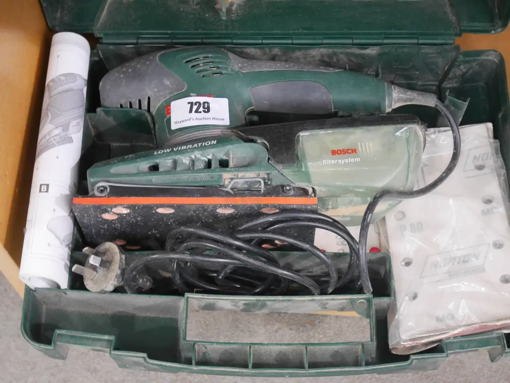 Bosch cased orbital sander with additional sanding pads Image 1++