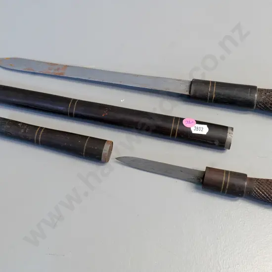 2 knives in wood and metal sheaths - larger one is L-430 closed