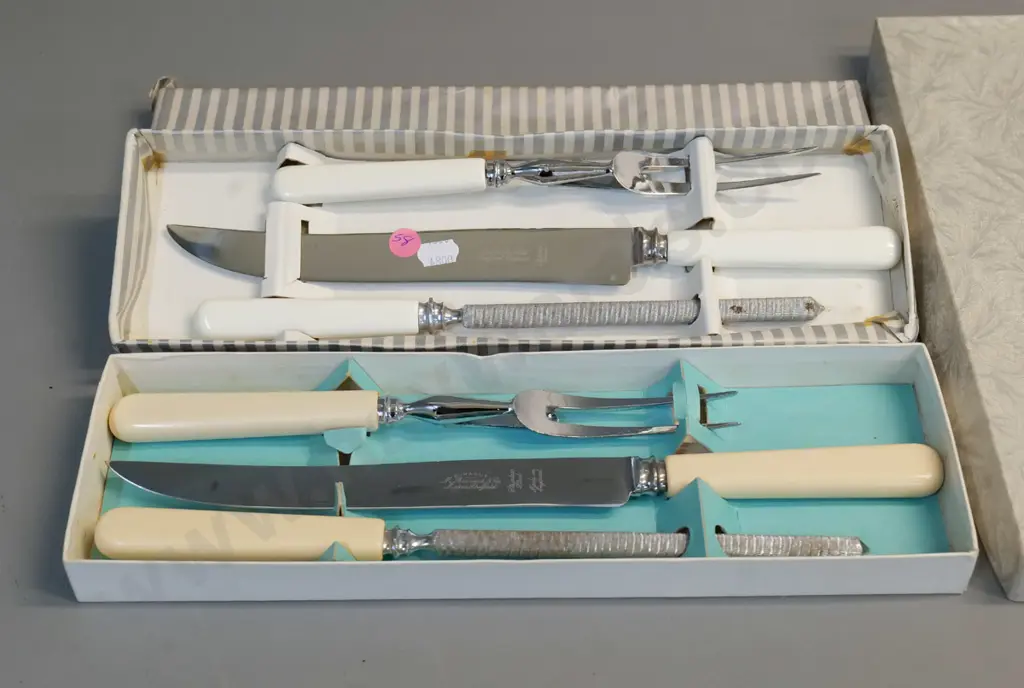 2 Sheffield carving sets - one bone handled, one faux ivory has some corrosion to sharpening steel Image 1++