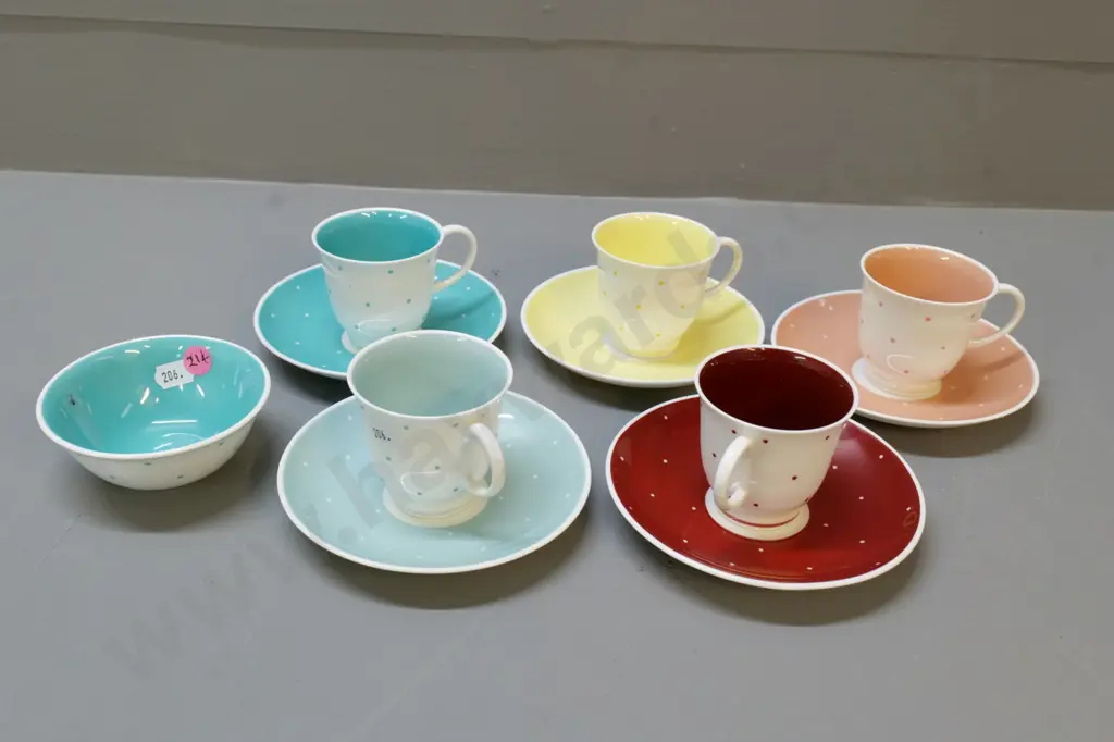 5 various coloured Susie Cooper coffee cups & saucers and a sugar bowl Image 1++